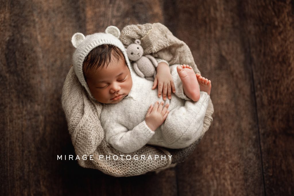 newborn baby boy in photography studio in Fowlerville, MI
