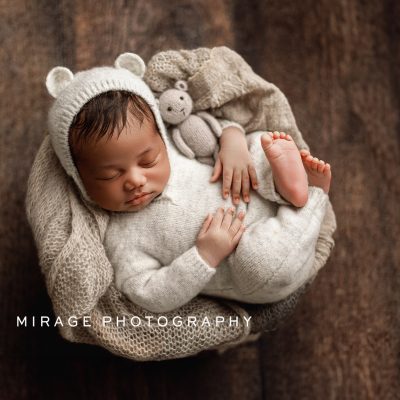 newborn baby boy in photography studio in Fowlerville, MI