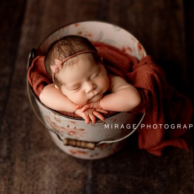 newborn girl in bucket