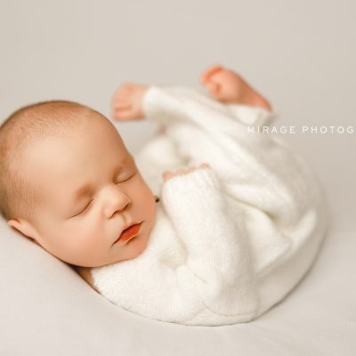 baby on simple white background in studio photo session