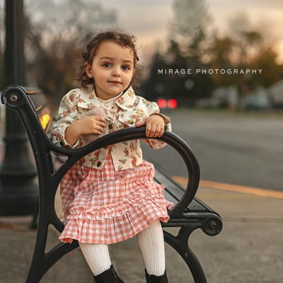 Toddler girl on bench photoshoot in Howell MI