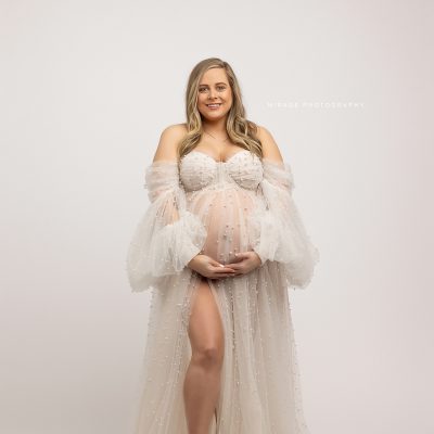 pregnant woman in white gown