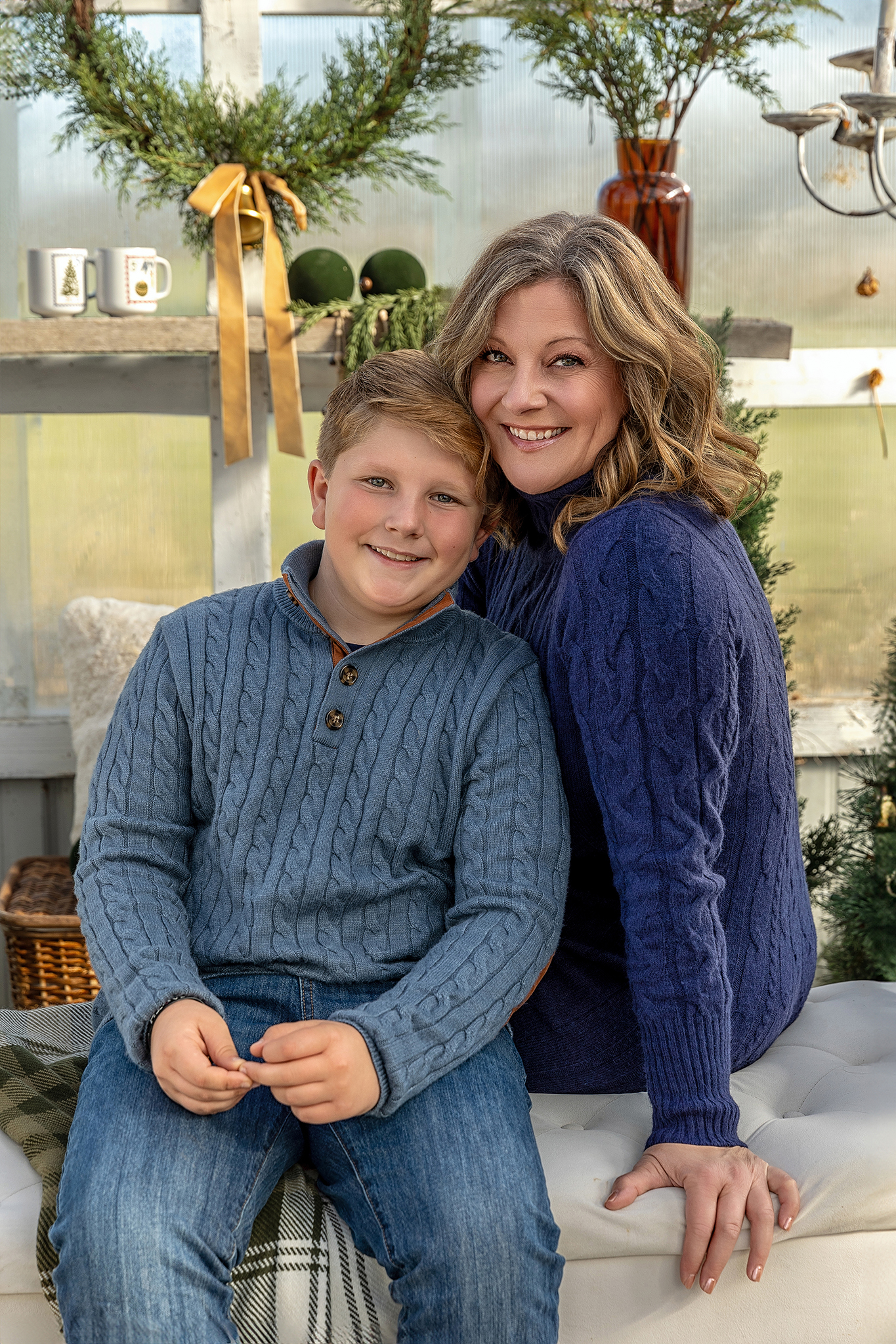 Neutral holiday outfit palette: cream sweater, gray knit, and jeans
