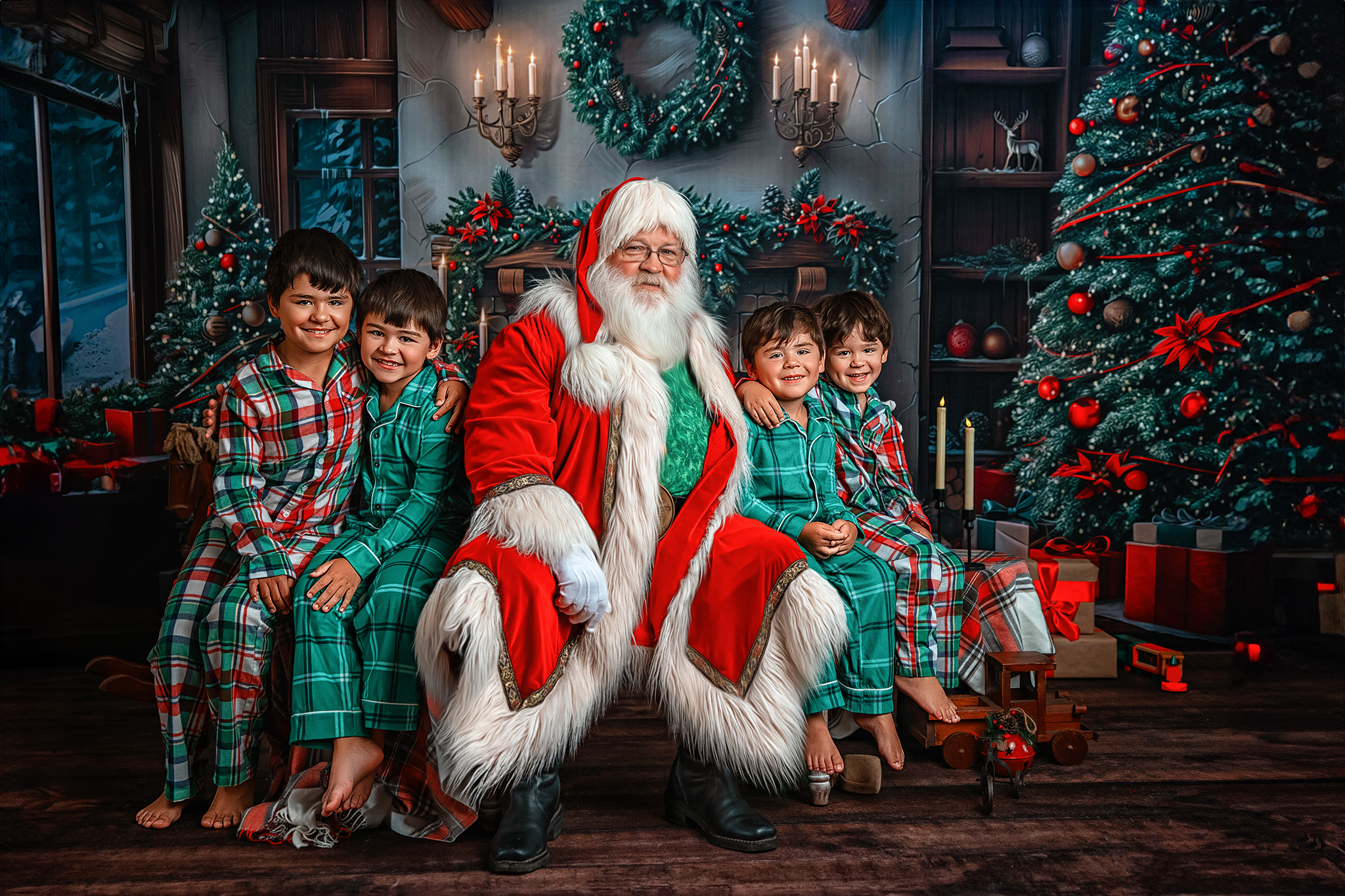 Santa sitting with four smiling brothers in matching Christmas pajamas